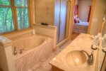 Spa tub in ensuite bath, perfect after a day of hiking Mt. Yonah or adventuring in Helen